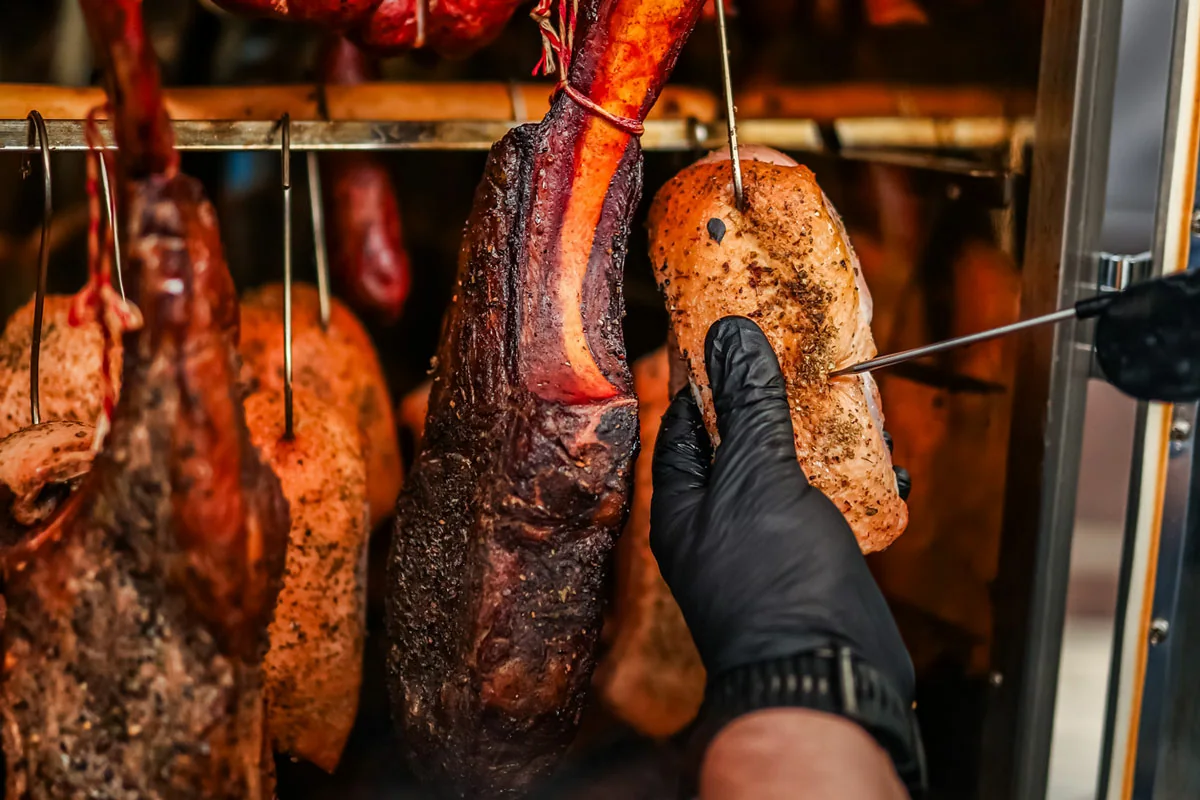 Meat inside a Borniak smoker during reverse sear preparation